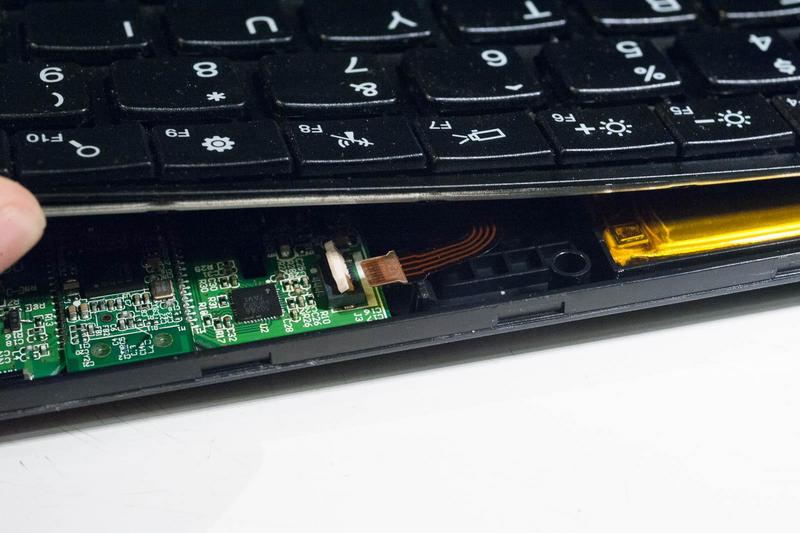 the rear of the case lifted open just enough to reveal the trackpoint
    connector