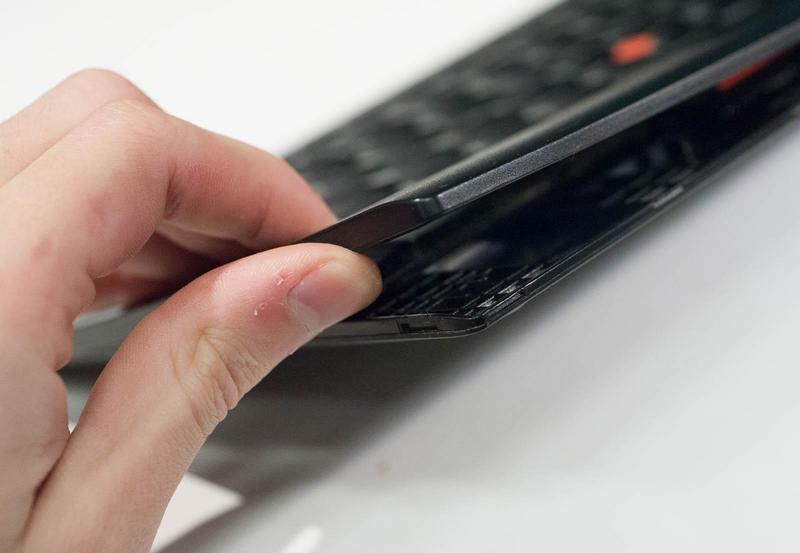 Flexing open the bottom left corner of the case